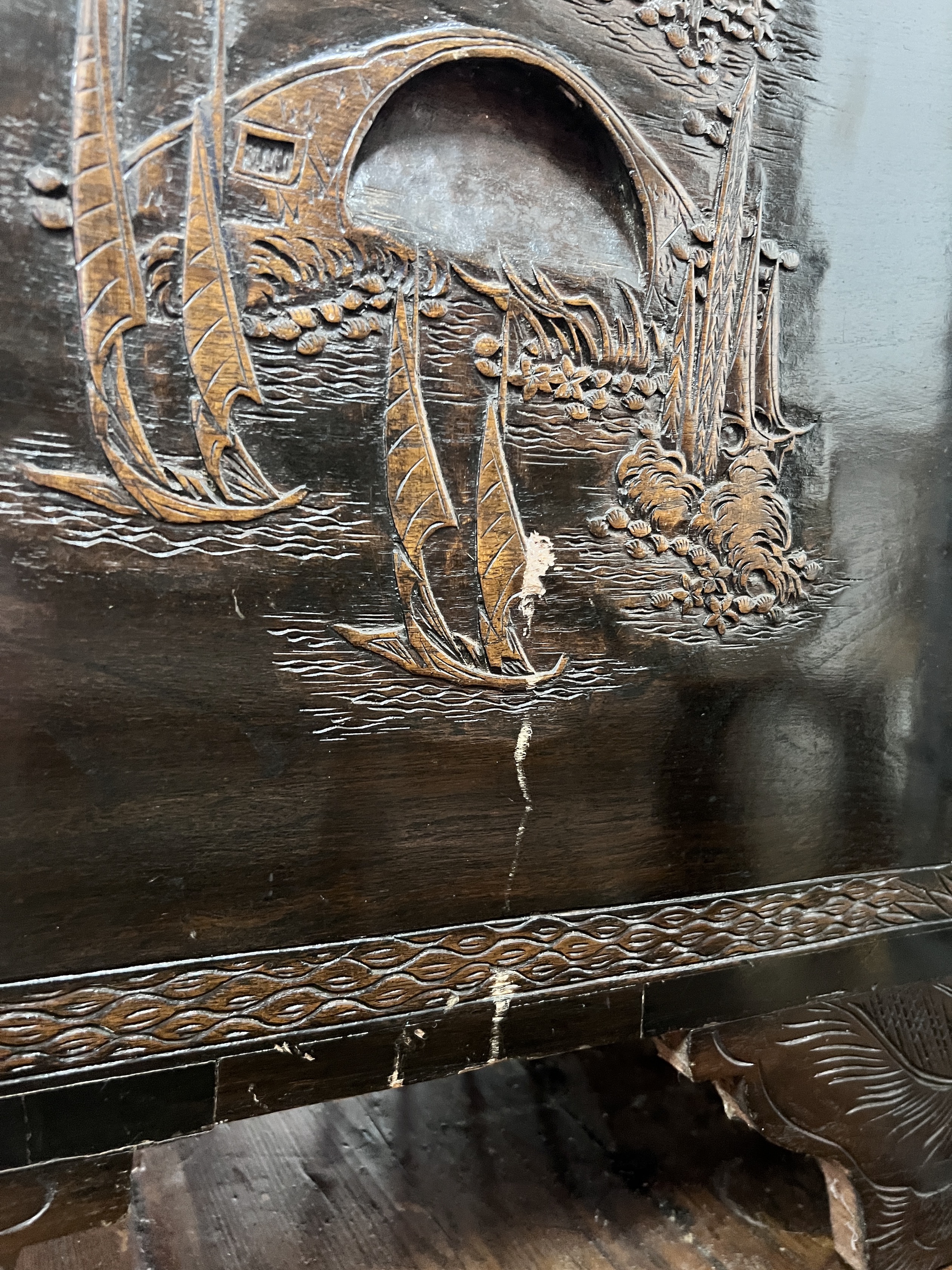 A Chinese carved camphorwood trunk, width 104cm, depth 54cm, height 66cm